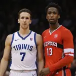 Travis Hyman, American basketball player in action on the court.