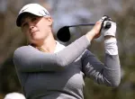 Amanda Blumenherst playing golf on a sunny course