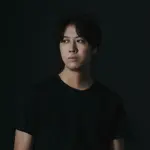 Portrait of Fumito Iwai in a musical setting