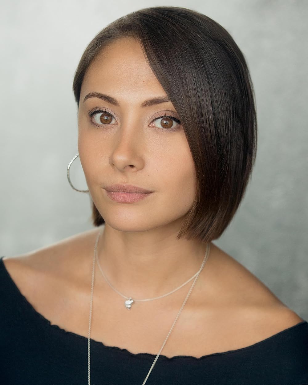 Klariza Clayton smiling portrait in soft lighting