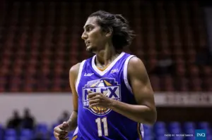 Alex Mallari playing basketball with determination and focus.
