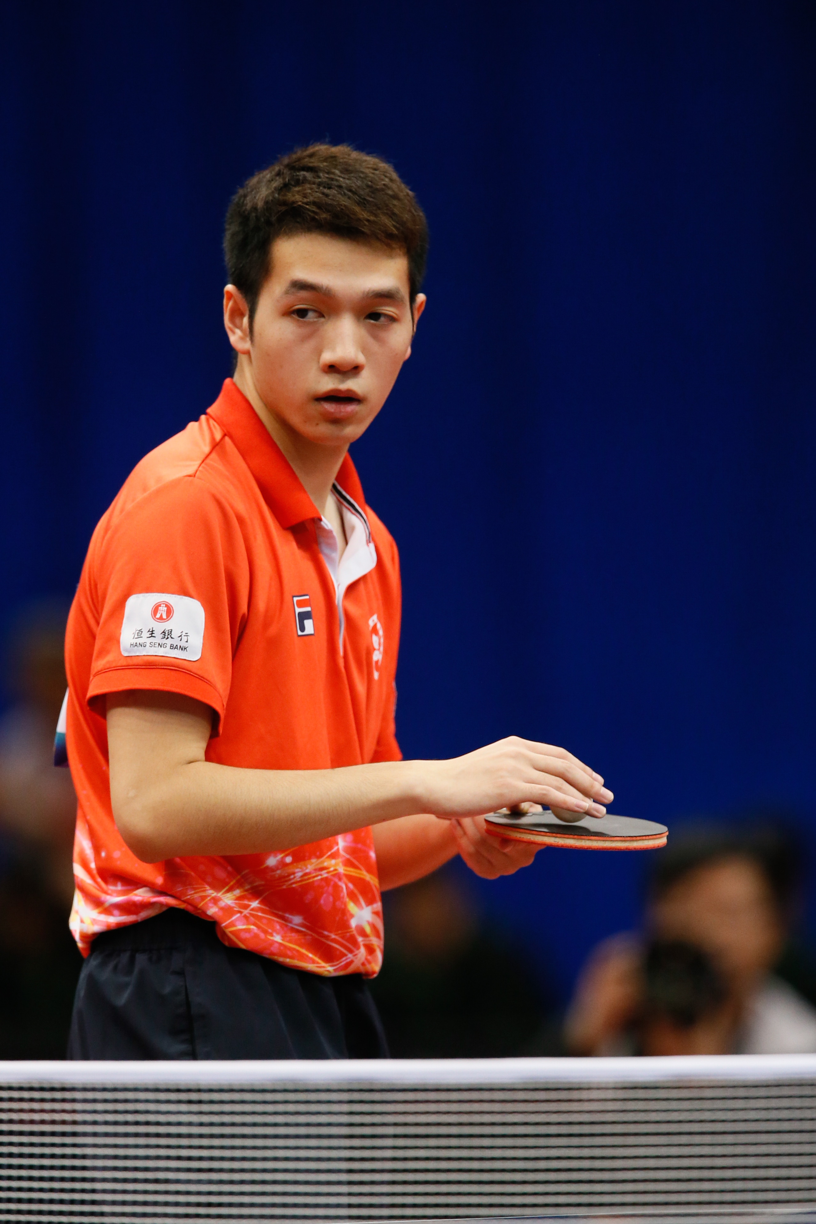 Ho Kwan Kit mid-rally in international match