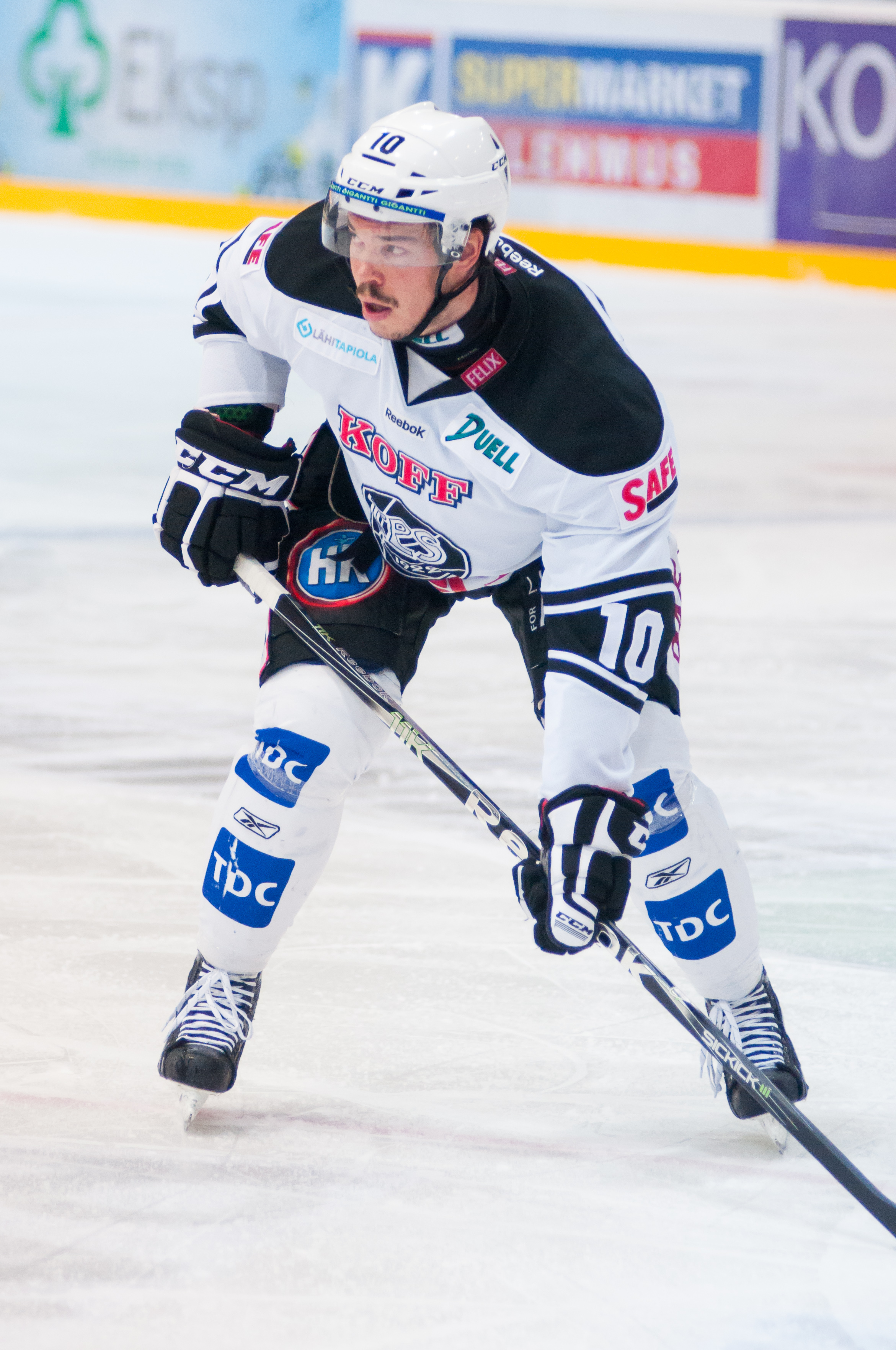 Focused Finnish hockey forward with determined expression