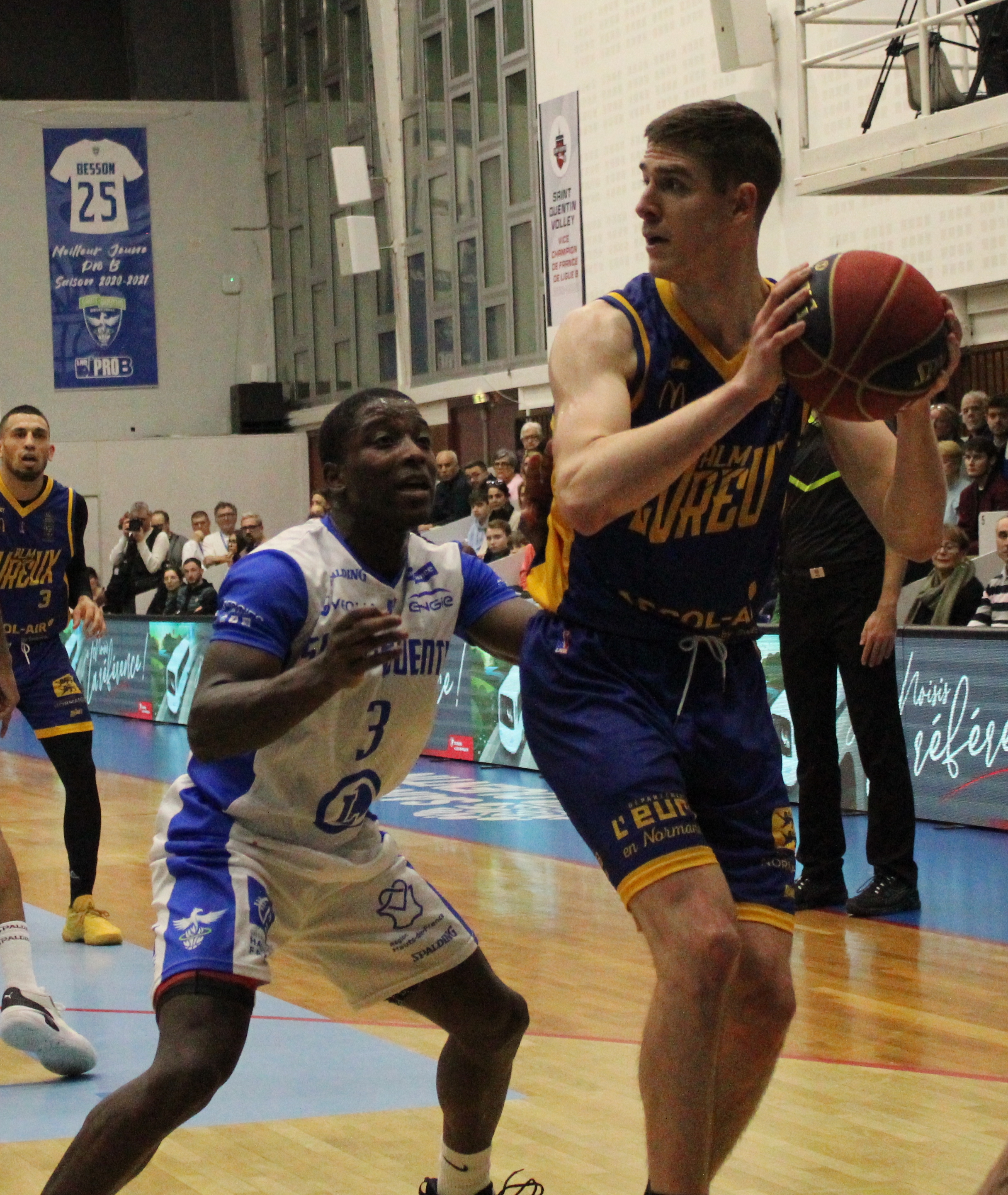 Luka Ašćerić driving the ball during a European basketball match