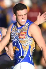 Jake Waterman kicking for goal with West Coast Eagles