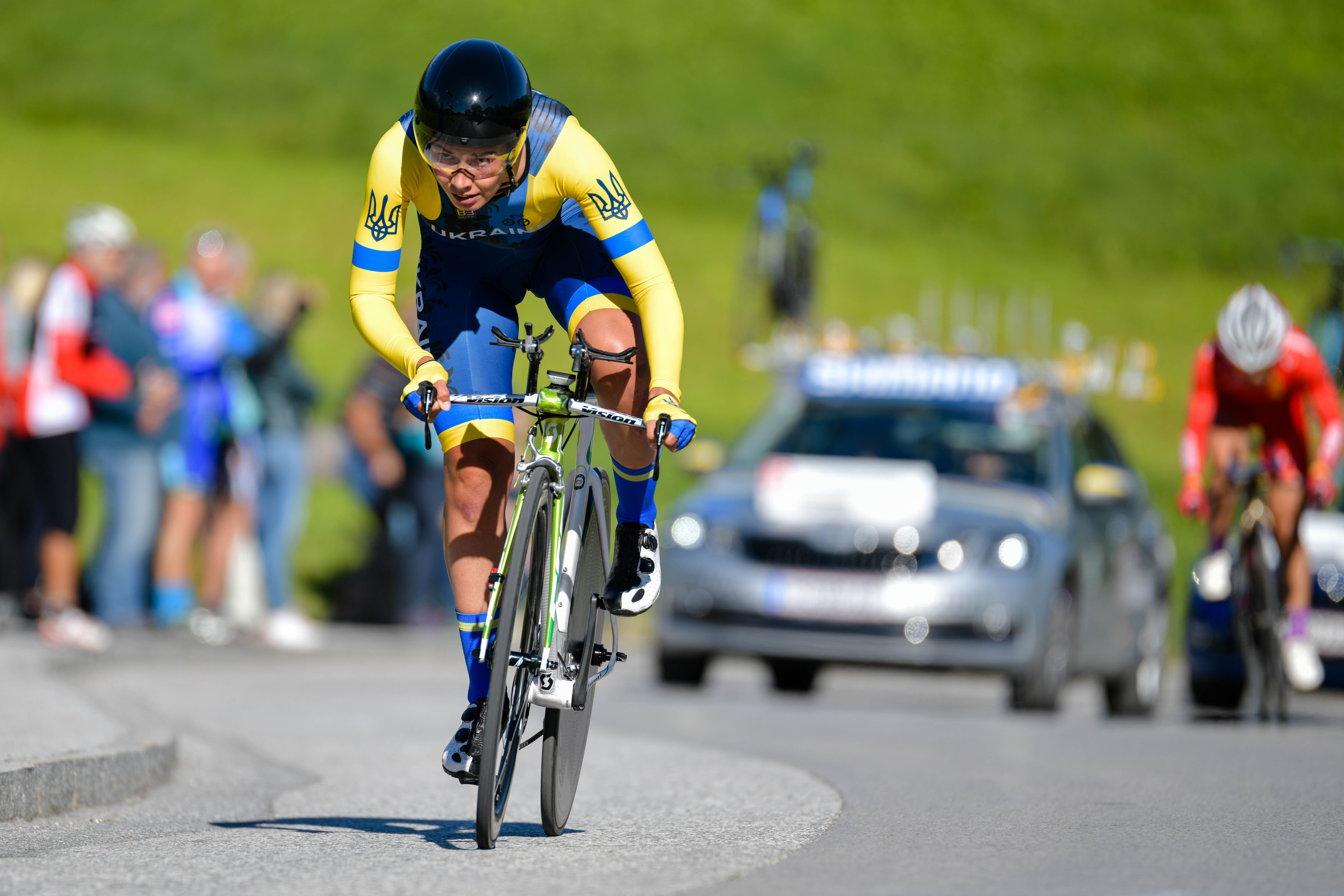 Valeriya Kononenko riding in a competitive road cycling race