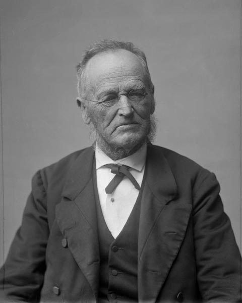 Distinguished portrait of John Wallis Barnicoat smiling calmly