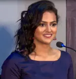 Shraddha Srinath smiling at film event in India