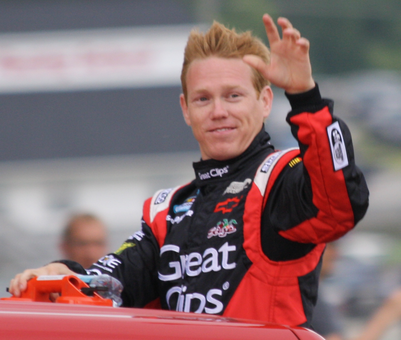 Brad Sweet celebrating sprint car racing victory in NAPA Auto Parts car