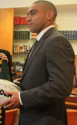 Nathan Merritt sprinting in Rabbitohs green-red jersey