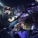 Jason Hartless performing on major rock tour